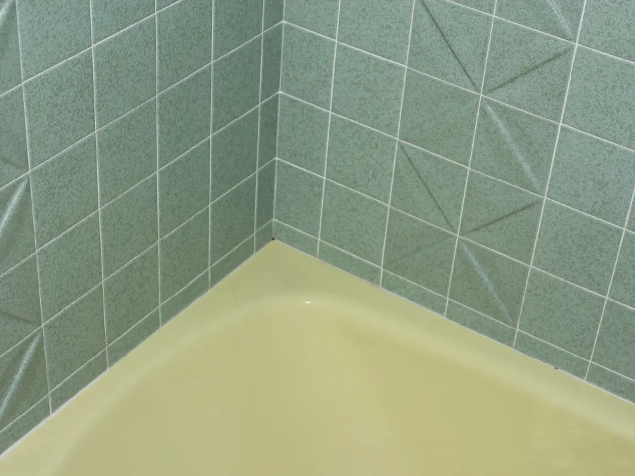 Updated bathroom tile design recognized as timelessly chic in Nate Berkus' vintage bathroom design...