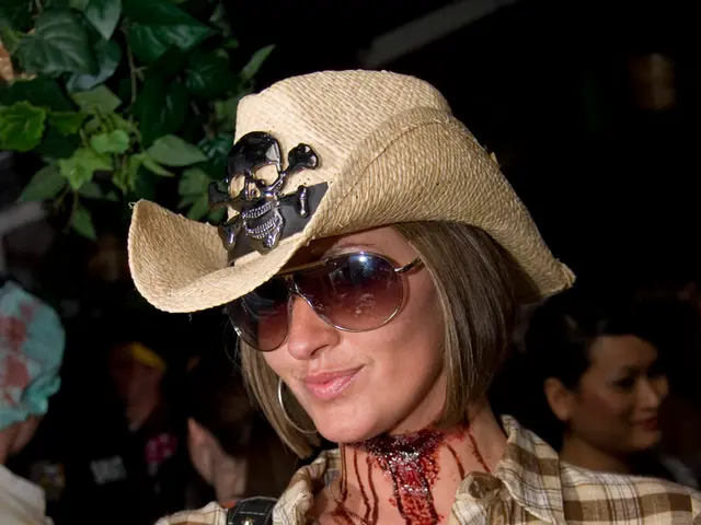 As we can see in the image there are group of people and plant. The woman standing in the front is...